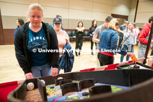 Students play carnival games during the End of Year Bash inside the East Campus Union on Saturday, A