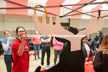 Students play carnival games during the End of Year Bash inside the East Campus Union on Saturday, A