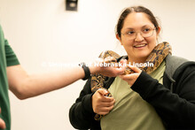 Students pet and hold animals during the End of Year Bash inside the East Campus Union on Saturday, 