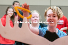Students play carnival games during the End of Year Bash inside the East Campus Union on Saturday, A