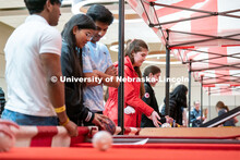 Students play carnival games during the End of Year Bash inside the East Campus Union on Saturday, A