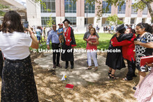 Antonio Linhart and family pose for photos following the UNL undergraduate commencement in Memorial 
