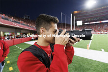 Kurk Rangel, a sports media major in the College of Journalism and Mass Communication, photographs t