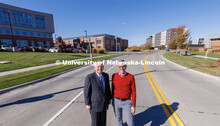NIC Executive Director Dan Duncan and UNL Chancellor Ronnie Green standing Transformation Drive lead