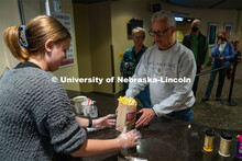 Freshman Emma Georgia helps prepare popcorn for moviegoers at the Ross Theater November 9, 2022. 