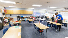 Nebraska honors students Spencer Knight, right, and Rohan Tatineni, left, work with Riley Elementary