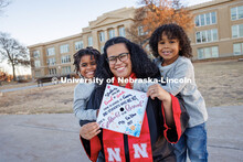La’Rae Pickens-Bonebright with her sons Amarien, 6, and JJ, 4. In the background stands Lincoln Hi