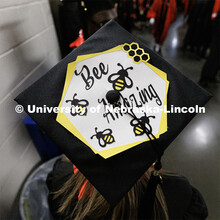 College of Business Management graduate Maggie Targy and her decorated mortar board. Winter Undergra