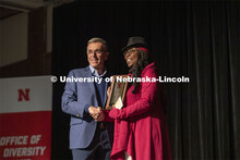 Chancellor Ronnie Green awards Lory Dance the award as the Fulfilling the Dream Community Award Reci