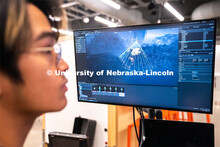 Sophomore emerging media arts major Xander Muniz adjusts a light inside an environment in Unreal Eng