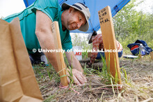 Kyle Flammang, a senior in geography, works on his dig area. LuAnn Wandsnider is leading anthropolog