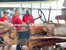 Rodney Bennett looks over a preserved tractor from the Alaskan land of the last homesteader. The tra