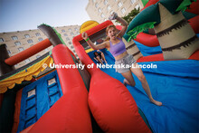 In a battle of new friends named Isabel(l), Isabell Zeller, slides down the inflatable maze ahead of