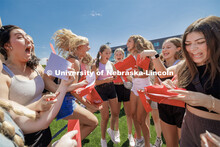 New sorority members react as they open their bid cards Saturday. Sorority Bid Day in the Cather Din
