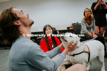 Students pet therapy dog, Aspen in the Love Library and Dinsdale Family Learning Commons to de-stres