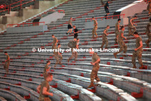 Army ROTC cadets spring up the steps in Memorial Stadium. ROTC cadets and midshipmen run 110 flights