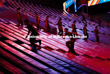 Army ROTC cadets spring up the steps in Memorial Stadium. ROTC cadets and midshipmen run 110 flights