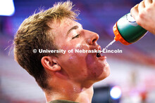 Army ROTC cadet Kray Kingston grabs a drink in between running the flights of stairs. ROTC cadets an
