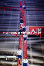 Air Force cadets run the stairs in north stadium. ROTC cadets and midshipmen run 110 flights of stai