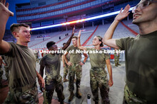 Five Eschleman, left, high fives Malorie Mulligan following their stair climbs. ROTC cadets and mids