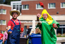 Sean Cuthbert, tosses a bag as he and Mitchel Brever, play corn hole at the Student Tailgate in the 