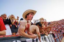 Students in the Boneyard section cheer during the first half. Northern Illinois football in Memorial