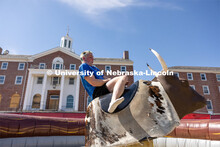 Gavin McGerr attempts to ride a mechanical bull at Hanging with the Huskers event. September 29, 202
