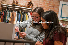 Hannah Robke (left) and Marissa Kraus shop downtown at Tsuru. About Lincoln at Pattino Shoe Boutique