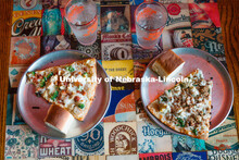 Plates of pizza sit on the table at YiaYia’s Pizza. About Lincoln at YiaYia’s Pizza. October 18,