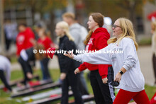 Morgan Weber lets a bag fly during Homecoming Cornhole Tournament in the greenspace by the Nebraska 