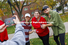 Nghi Ho, left, and Mackenzie Noble, right, have their photograph taken with Grace Puccio, tournament