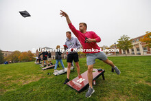 Brayan Van Meter throws a bag as he competes for Phi Delta Theta. Cornhole Tournament for Homecoming