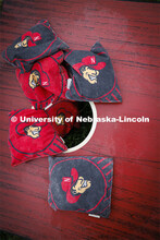 A pile of Herbie Husker bags await the next game. Cornhole Tournament for Homecoming in the greenspa