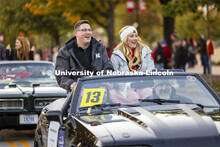 Homecoming royalty candidates Dylan Anderson and Madison Stracke wave to the crowd along the parade 