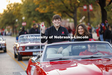Homecoming royalty candidates Preston Kotik and Ritsa Giannakas wave to the crowd along the parade r