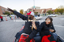 Chancellor Rodney Bennett and his wife, Temple, wave to the crowd as the parade turns onto 14th Stre
