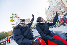 Chancellor Rodney Bennett and his wife, Temple, wave to the crowd as the parade passes Memorial Stad