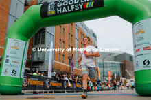 Runners cross the finish line. The Good Life Halfsy half marathon runs through the streets of Lincol