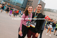 Runners pose for a picture with their medals. The Good Life Halfsy half marathon runs through the st