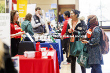 Urmila Manandhar and Noshin Ara Tunazzina talk with recruiters from the Office of Research at the Ea