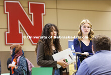 Airlee Freeman and Marissa Davis talk with recruiters at the East Campus Career Fair. February 8, 20