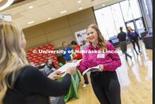 Ainsley Fischer talks with a recruiter from Frontier Cooperative at the East Campus Career Fair. Feb