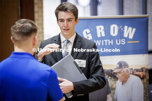 Ian Klaes talks with a recruiter from Farmers Cooperative in Dorchester, NE, at the East Campus Care
