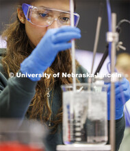 Kimberly Zamora Mendez checks the temperature on a beaker of water. LIFE 120L - Fundamentals of Biol