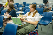 Kate Wandsnider a Junior Global Studies major holds a Will Eisner book, “A Contract With God and O