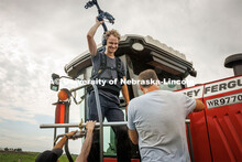 Filming a tractor in the field. Farming scenes. Behind the scenes photo for the university's new "Ho