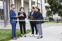 Lecturer Rachel Tomlinson Dick (center) talks with students in the Housing Justice Clinic outside of