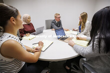 Professor Kevin Ruser meets with law students in the Immigration Clinic. College of Law Clinics. Sep