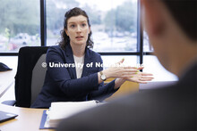 Lecturer Liz Cole talks with a law student in the Innocence Clinic. College of Law Clinics. Septembe