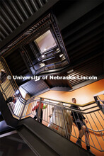 Bailey Dieckmann’s family heads down the stairs in Knoll Residence Hall with the cardboard remains